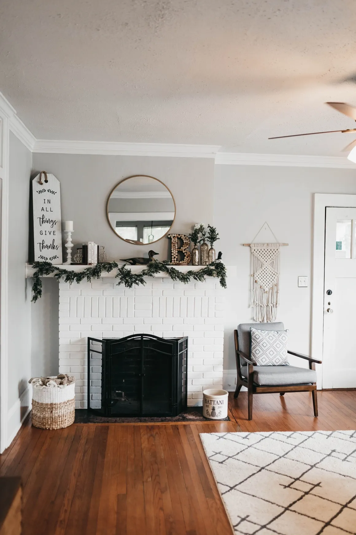 Cozy living room with a decorated fireplace and modern rug.